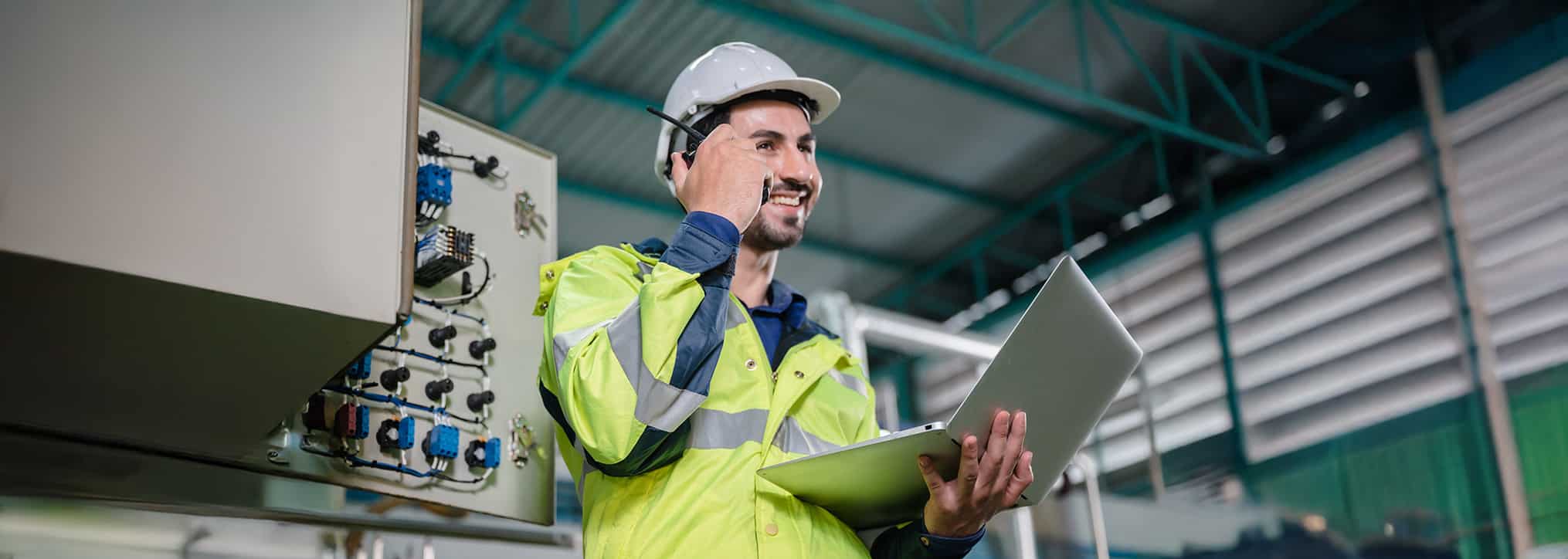 Service technician talking on the phone on site